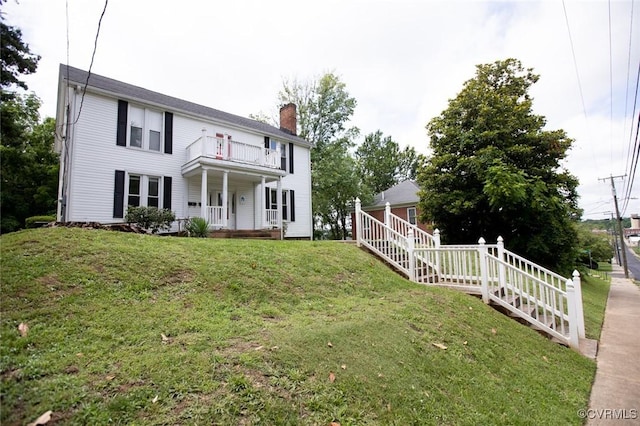 405 E 2nd St, Farmville, VA 23901 - back of property with a balcony, a chimney, a porch, and a yard