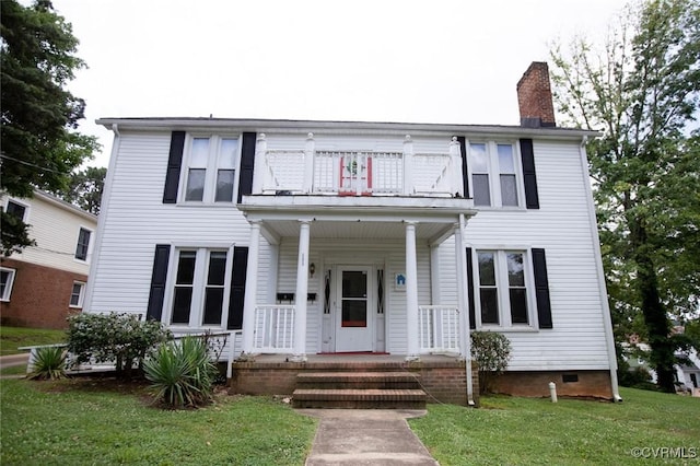 405 E 2nd St, Farmville, VA 23901 - view of front facade featuring a balcony, a chimney, covered porch, a front lawn, and crawl space