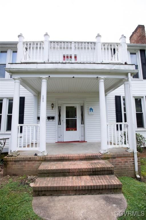 405 E 2nd St, Farmville, VA 23901 - view of exterior entry featuring covered porch and a balcony