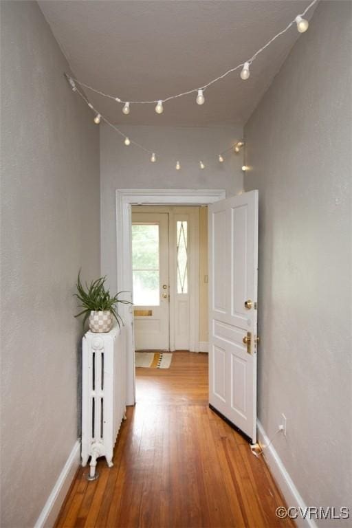 405 E 2nd St, Farmville, VA 23901 - hallway with radiator and wood finished floors