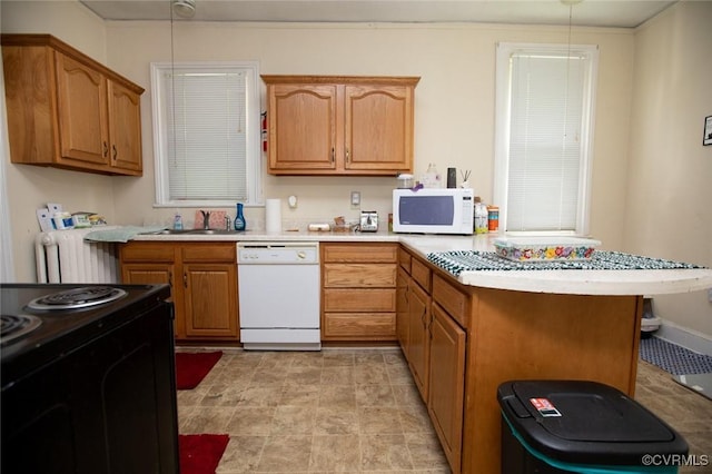 405 E 2nd St, Farmville, VA 23901 - kitchen featuring white appliances, a peninsula, light countertops, a kitchen breakfast bar, and radiator heating unit