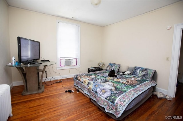 405 E 2nd St, Farmville, VA 23901 - bedroom featuring radiator, cooling unit, and wood finished floors