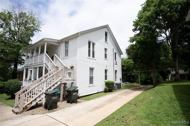 405 E 2nd St, Farmville, VA 23901 - view of property exterior featuring stairway, a lawn, and driveway