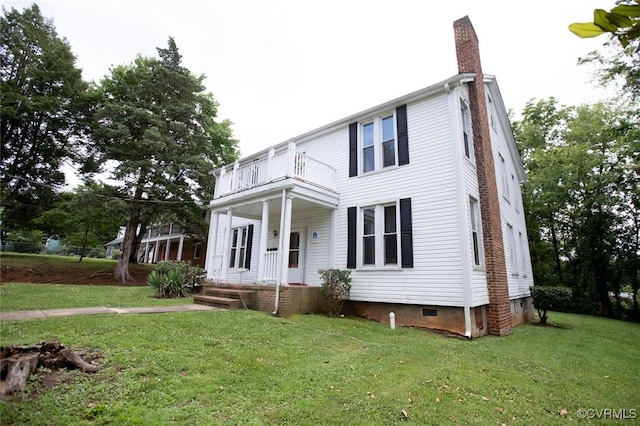 405 E 2nd St, Farmville, VA 23901 - view of front of property featuring a balcony, a chimney, covered porch, crawl space, and a front yard