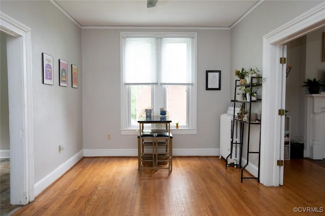 405 E 2nd St, Farmville, VA 23901 - dining space featuring wood finished floors, radiator, and crown molding
