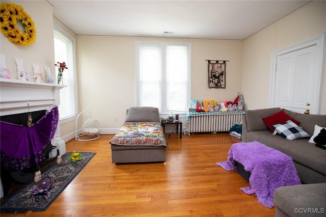 405 E 2nd St, Farmville, VA 23901 - living room featuring radiator and wood finished floors