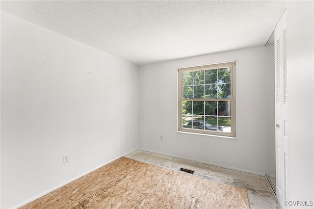 9502 Timber Pass, Glen Allen, VA 23060 - empty room featuring a textured ceiling and baseboards