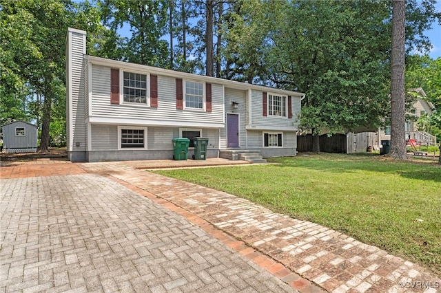 9502 Timber Pass, Glen Allen, VA 23060 - split foyer home with a storage shed, a chimney, and a front lawn