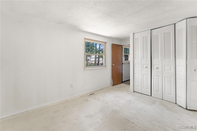 9502 Timber Pass, Glen Allen, VA 23060 - unfurnished bedroom featuring a textured ceiling, a closet, and concrete flooring