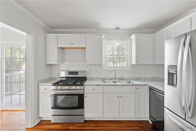 6437 Moon Ln, Chesterfield, VA 23234 - kitchen with stainless steel appliances, white cabinetry, plenty of natural light, and crown molding