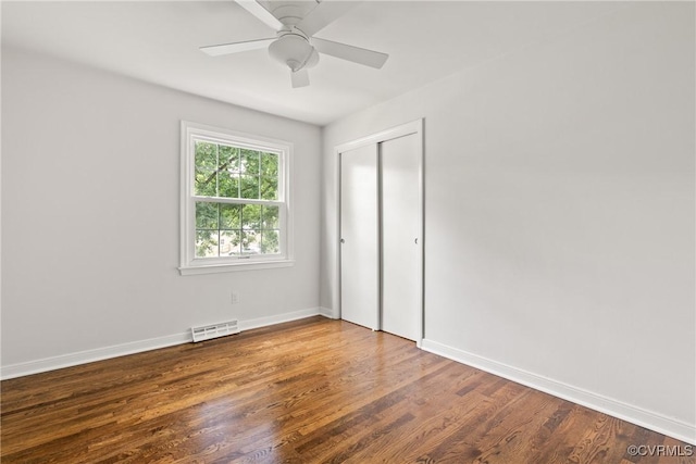 6437 Moon Ln, Chesterfield, VA 23234 - unfurnished bedroom with wood finished floors, a closet, and a ceiling fan