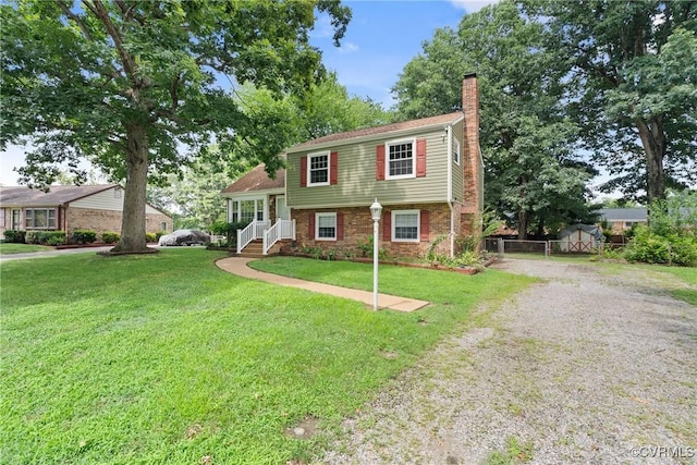 6437 Moon Ln, Chesterfield, VA 23234 - tri-level home with a chimney, gravel driveway, and brick siding