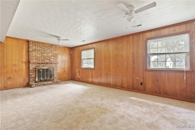6437 Moon Ln, Chesterfield, VA 23234 - unfurnished living room with a ceiling fan, wood walls, a fireplace, carpet floors, and ornamental molding
