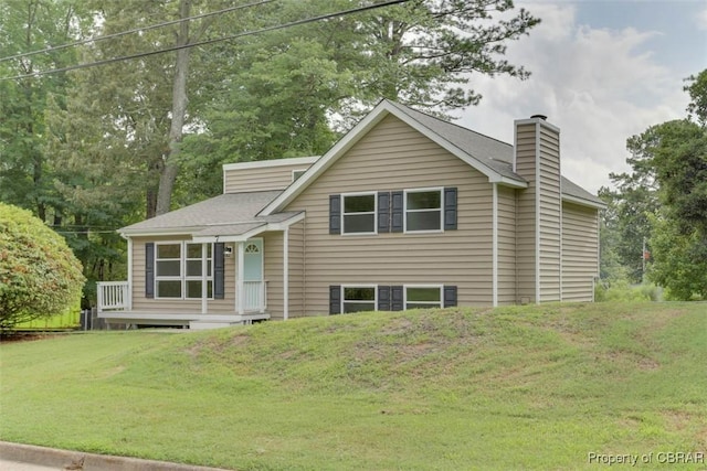 7 Cathy Dr, Newport News, VA 23608 - view of front of home with a chimney and a front lawn