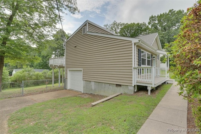 7 Cathy Dr, Newport News, VA 23608 - view of side of home featuring concrete driveway, crawl space, an attached garage, and a deck
