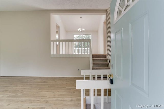 7 Cathy Dr, Newport News, VA 23608 - staircase featuring wood finished floors and a chandelier