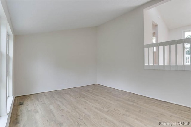 7 Cathy Dr, Newport News, VA 23608 - empty room with wood finished floors and vaulted ceiling