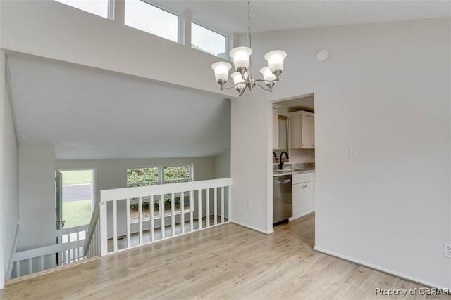 7 Cathy Dr, Newport News, VA 23608 - spare room featuring a chandelier, light wood-type flooring, and a towering ceiling