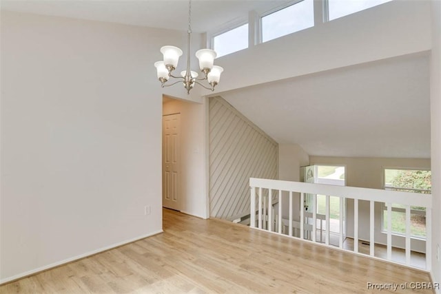 7 Cathy Dr, Newport News, VA 23608 - empty room with a chandelier, wood finished floors, and a high ceiling