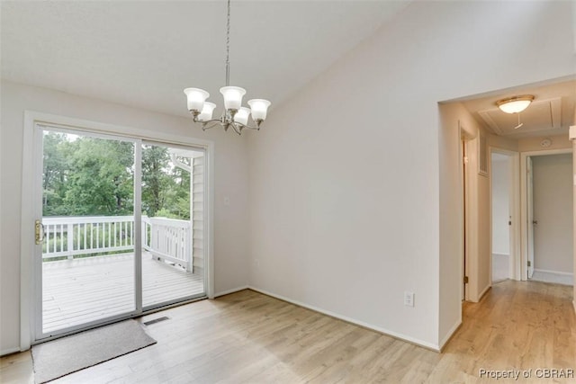 7 Cathy Dr, Newport News, VA 23608 - unfurnished dining area featuring light wood-style floors, attic access, and a chandelier