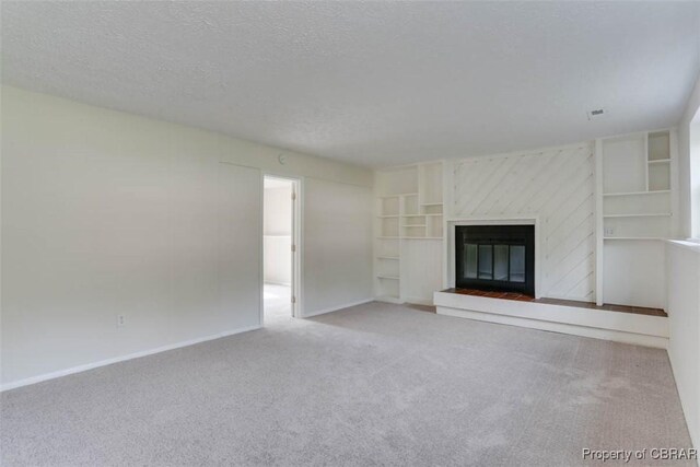 7 Cathy Dr, Newport News, VA 23608 - unfurnished living room with carpet, a glass covered fireplace, and a textured ceiling
