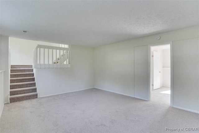 7 Cathy Dr, Newport News, VA 23608 - spare room featuring carpet, stairway, a textured ceiling, and a smoke detector