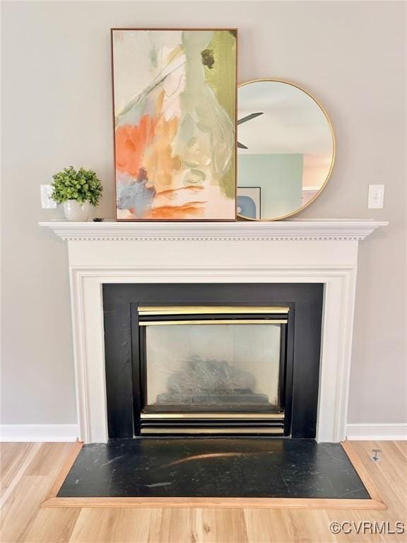 11809 Park Forest Ct, Henrico, VA 23059 - detailed view of a fireplace with flush hearth and wood finished floors