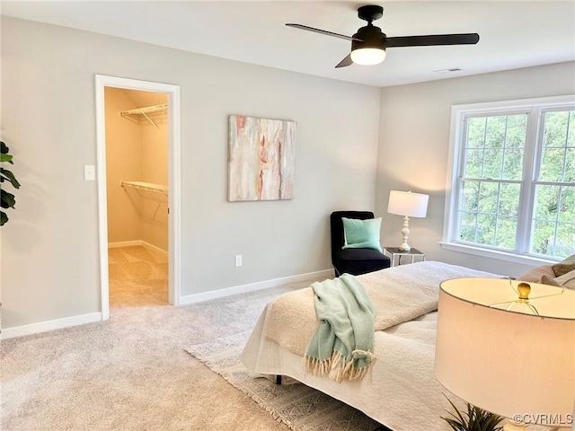 11809 Park Forest Ct, Henrico, VA 23059 - carpeted bedroom with a walk in closet and a ceiling fan