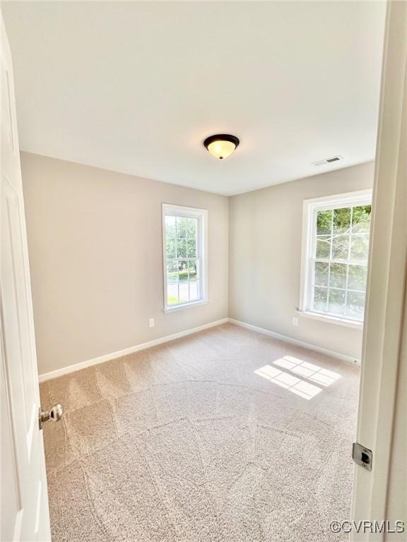 11809 Park Forest Ct, Henrico, VA 23059 - carpeted empty room with baseboards