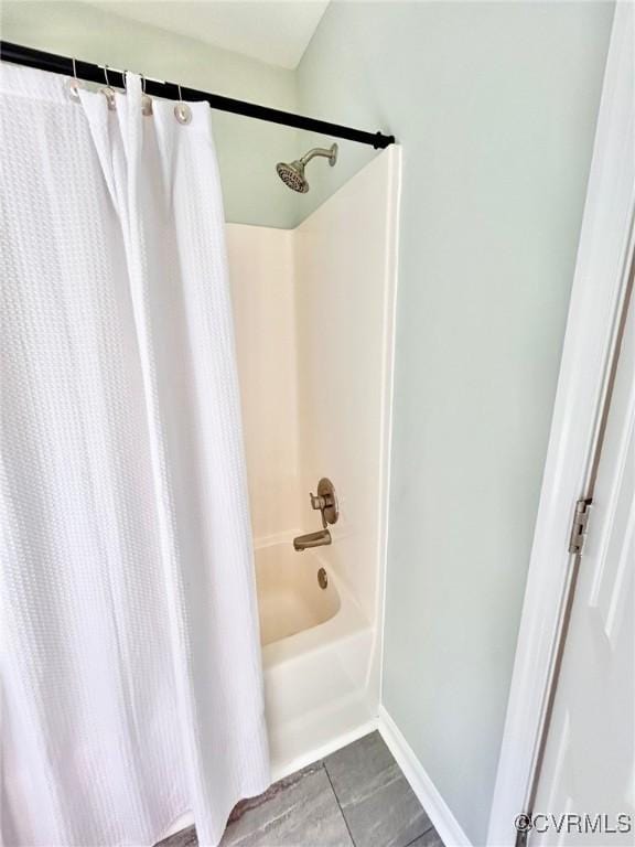 11809 Park Forest Ct, Henrico, VA 23059 - bathroom featuring shower / bath combo with shower curtain and baseboards