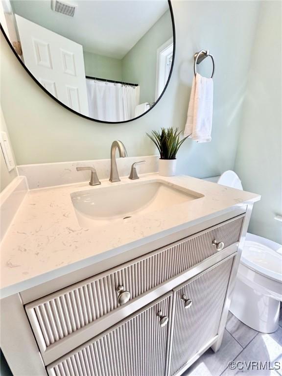 11809 Park Forest Ct, Henrico, VA 23059 - bathroom featuring toilet and vanity