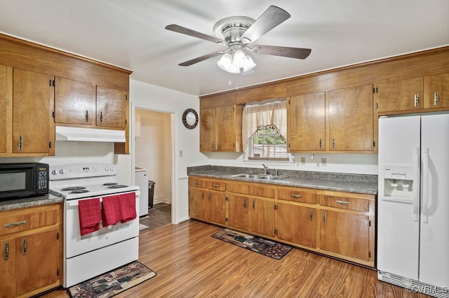 15116 Boydton Plank Rd, Dinwiddie, VA 23841 - kitchen with white appliances, under cabinet range hood, brown cabinets, and ceiling fan