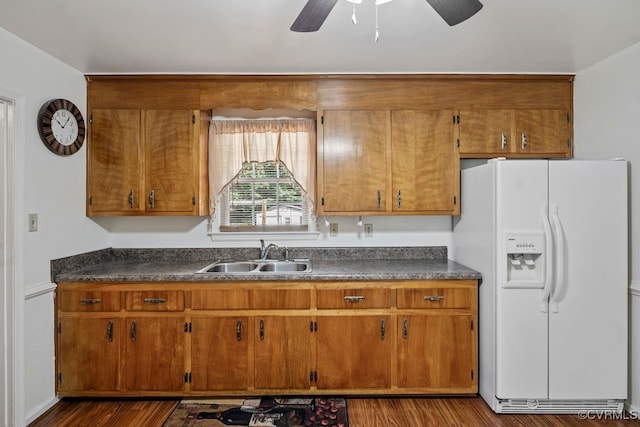 15116 Boydton Plank Rd, Dinwiddie, VA 23841 - kitchen featuring white fridge with ice dispenser, brown cabinets, and dark countertops