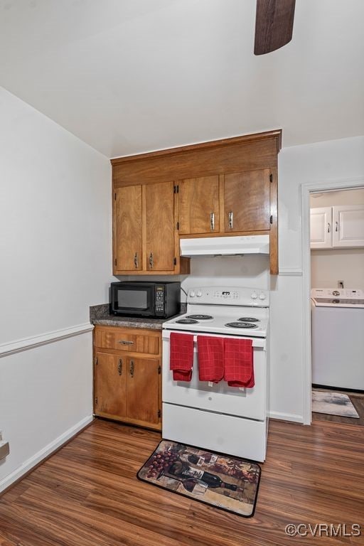 15116 Boydton Plank Rd, Dinwiddie, VA 23841 - kitchen featuring washer / clothes dryer, electric stove, black microwave, under cabinet range hood, and dark wood-style flooring