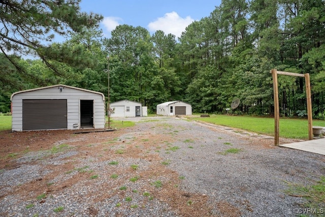 15116 Boydton Plank Rd, Dinwiddie, VA 23841 - view of yard featuring a storage shed and a garage