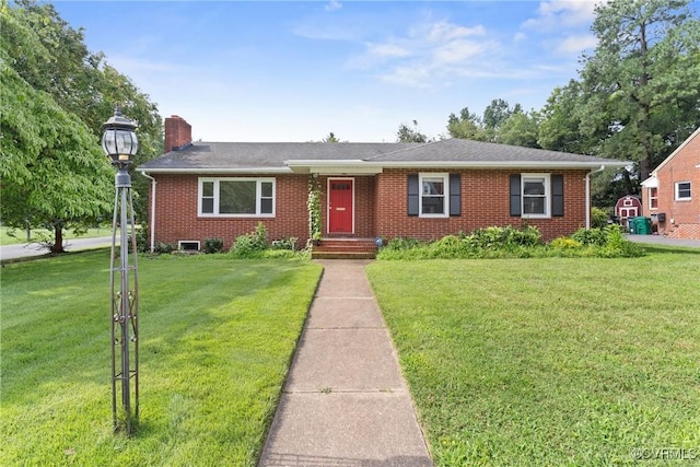 2301 Essex Rd, Henrico, VA 23228 - ranch-style house with brick siding, a chimney, a front yard, and a shingled roof
