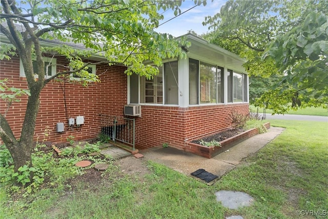 2301 Essex Rd, Henrico, VA 23228 - view of side of home with brick siding, a sunroom, a yard, and cooling unit