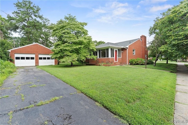 2301 Essex Rd, Henrico, VA 23228 - view of front facade with a garage, a front yard, brick siding, an outbuilding, and a chimney