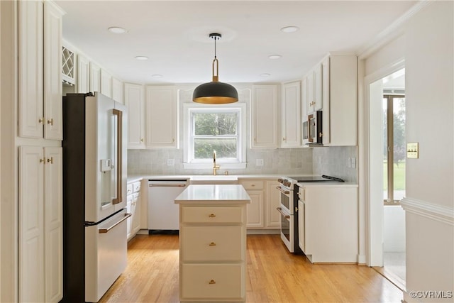2301 Essex Rd, Henrico, VA 23228 - kitchen featuring stainless steel appliances, a kitchen island, decorative backsplash, light countertops, and recessed lighting
