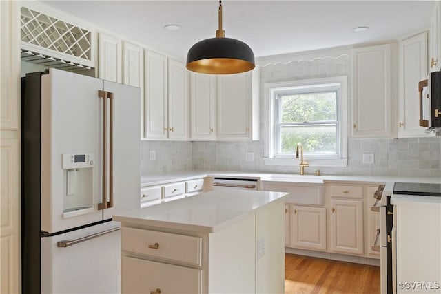 2301 Essex Rd, Henrico, VA 23228 - kitchen with white appliances, backsplash, light countertops, and white cabinets