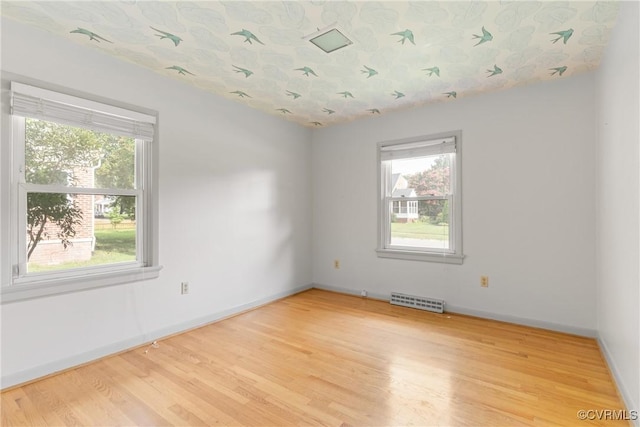 2301 Essex Rd, Henrico, VA 23228 - empty room featuring healthy amount of natural light and wood finished floors