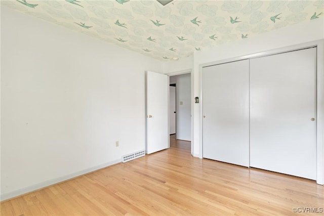 2301 Essex Rd, Henrico, VA 23228 - unfurnished bedroom with light wood-type flooring and a closet