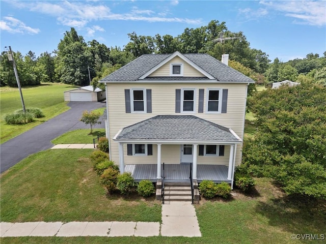 285 Jennings Ordinary Rd, Crewe, VA 23930 - american foursquare style home featuring an outdoor structure, covered porch, a chimney, and a front lawn