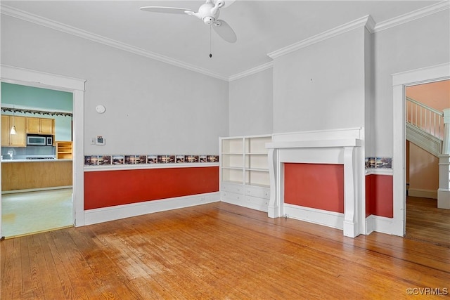 285 Jennings Ordinary Rd, Crewe, VA 23930 - unfurnished living room with hardwood / wood-style floors, ceiling fan, ornamental molding, and a fireplace