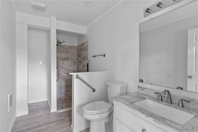 285 Jennings Ordinary Rd, Crewe, VA 23930 - bathroom with vanity, a tile shower, wood finished floors, and crown molding