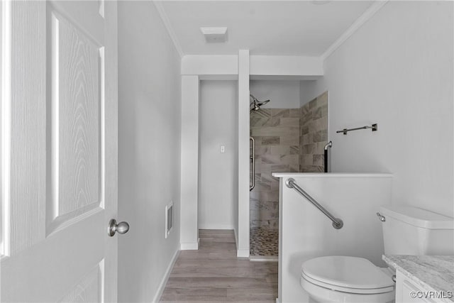 285 Jennings Ordinary Rd, Crewe, VA 23930 - bathroom with a tile shower, crown molding, wood finished floors, and vanity