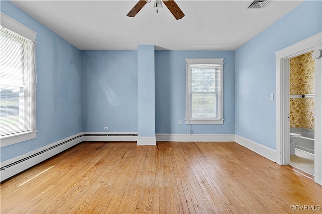 285 Jennings Ordinary Rd, Crewe, VA 23930 - unfurnished room featuring light wood finished floors, ceiling fan, and a baseboard heating unit