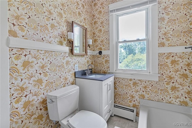 285 Jennings Ordinary Rd, Crewe, VA 23930 - bathroom featuring a baseboard heating unit, wallpapered walls, vanity, and a bath
