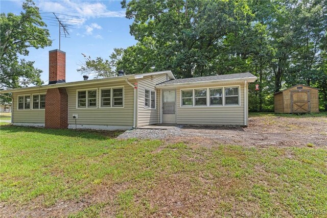 285 Jennings Ordinary Rd, Crewe, VA 23930 - back of house featuring a shed, a chimney, and a lawn