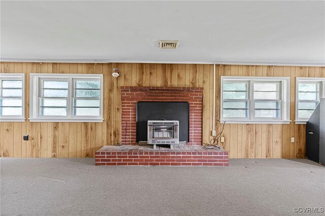 285 Jennings Ordinary Rd, Crewe, VA 23930 - unfurnished living room with heating unit, carpet, and wooden walls